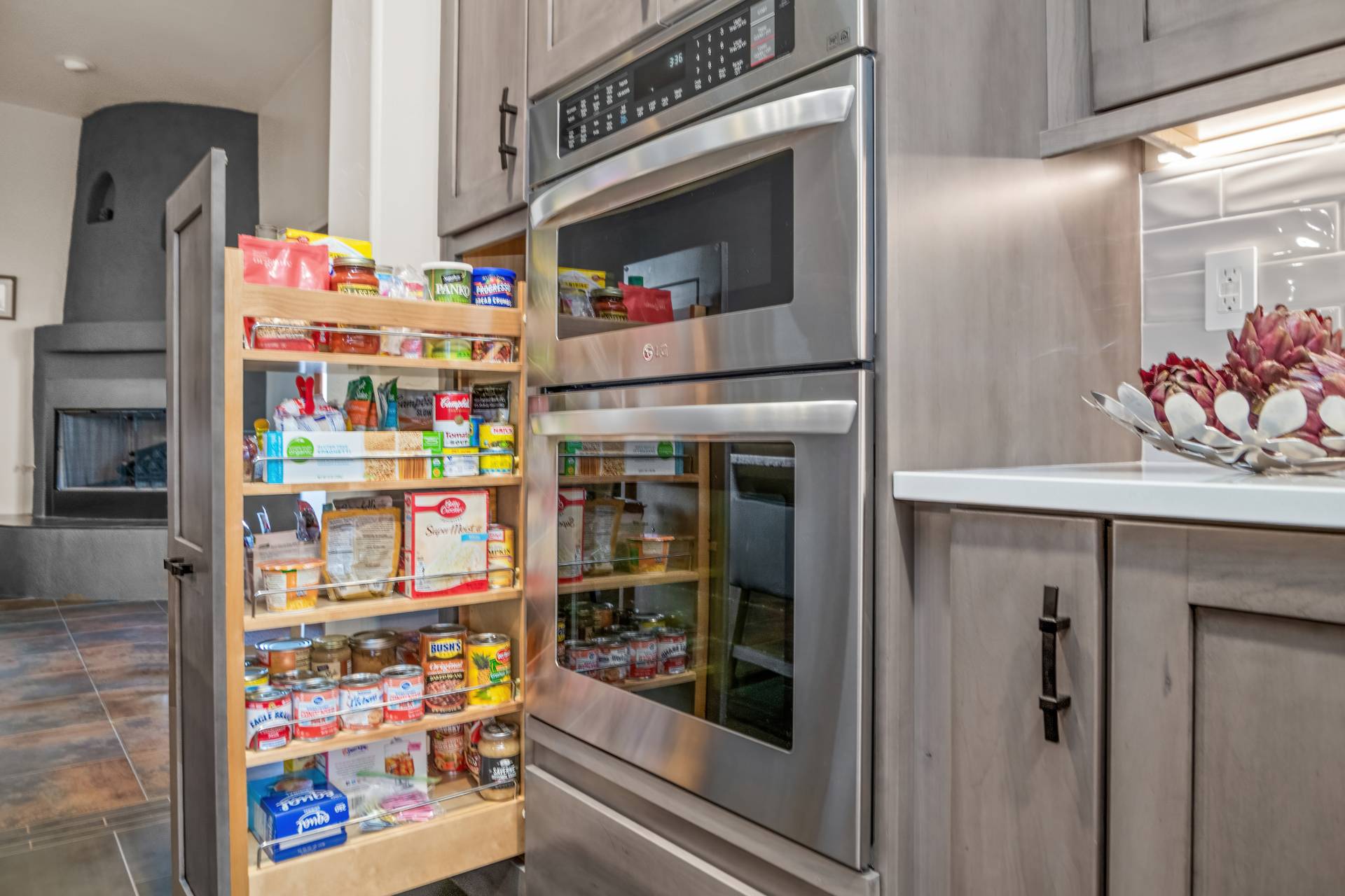 Tobey pantry with custom pull-out storage in gray-stained cabinetry
